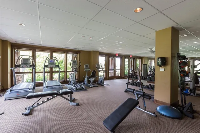 a living room with furniture a dining table and kitchen view