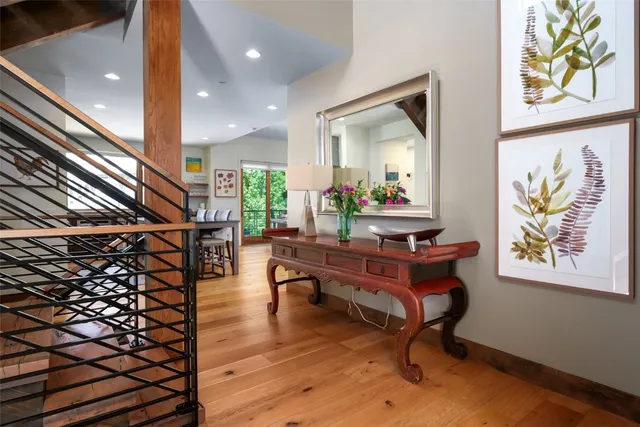 a room with lots of wooden furniture and a rug