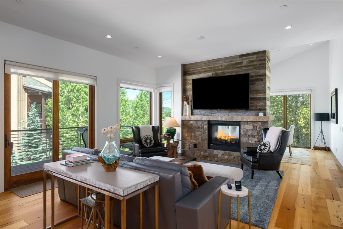 1468 Bangtail Way, Unit C Steamboat Springs, CO 80487 - Photo 6 of 50 Double sided fireplace between living and dining room