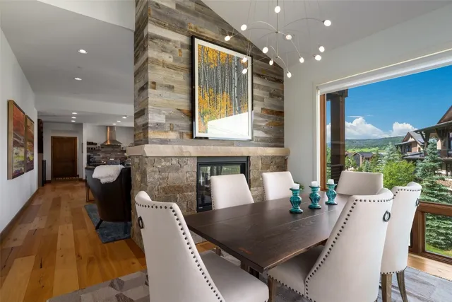 a dining room with furniture and wooden floor
