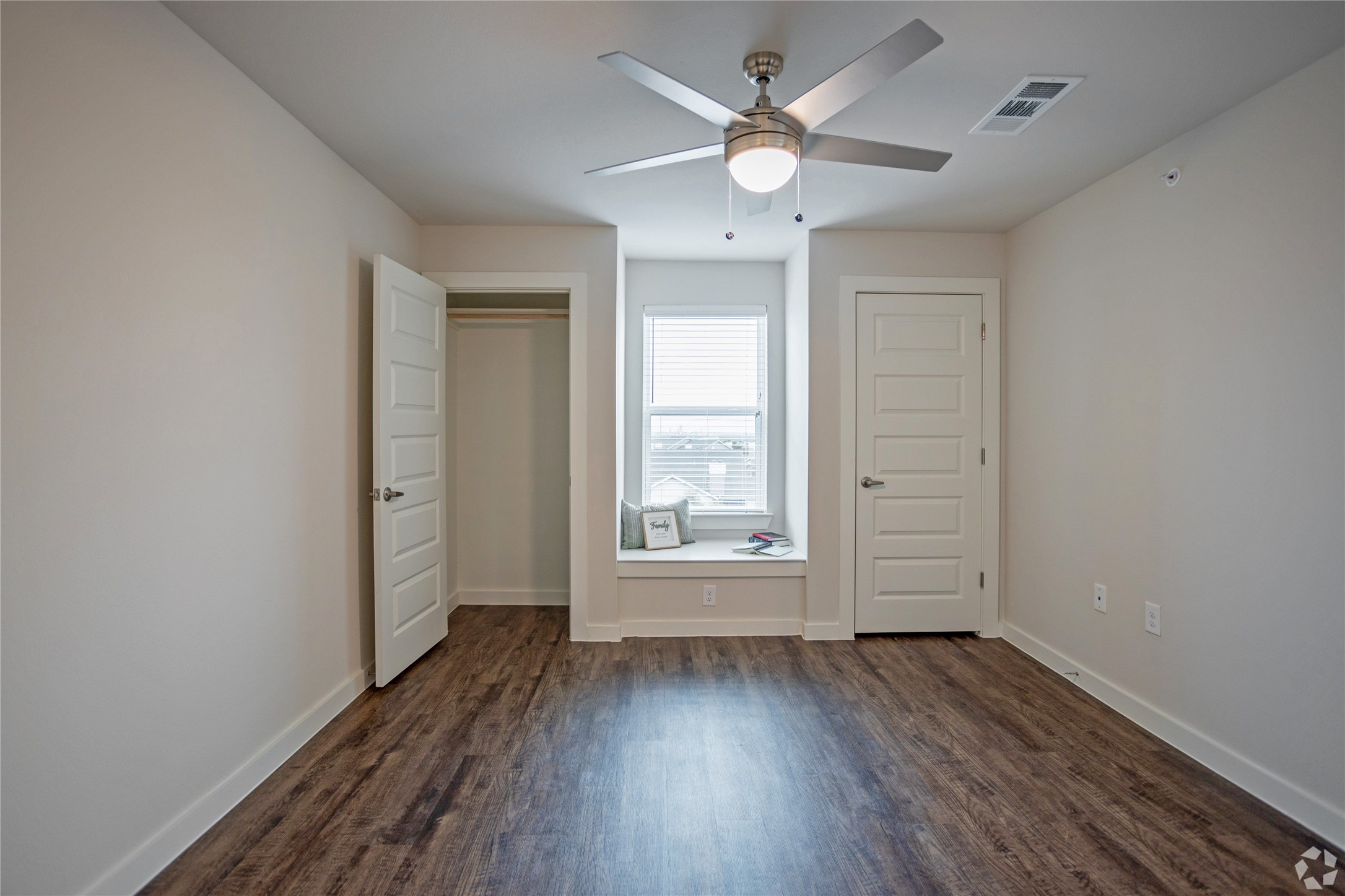 10010 North Capital Of Texas Highway, Unit 116 Austin, TX 78759 - Photo 17 of 20 an empty room with wooden floor and windows