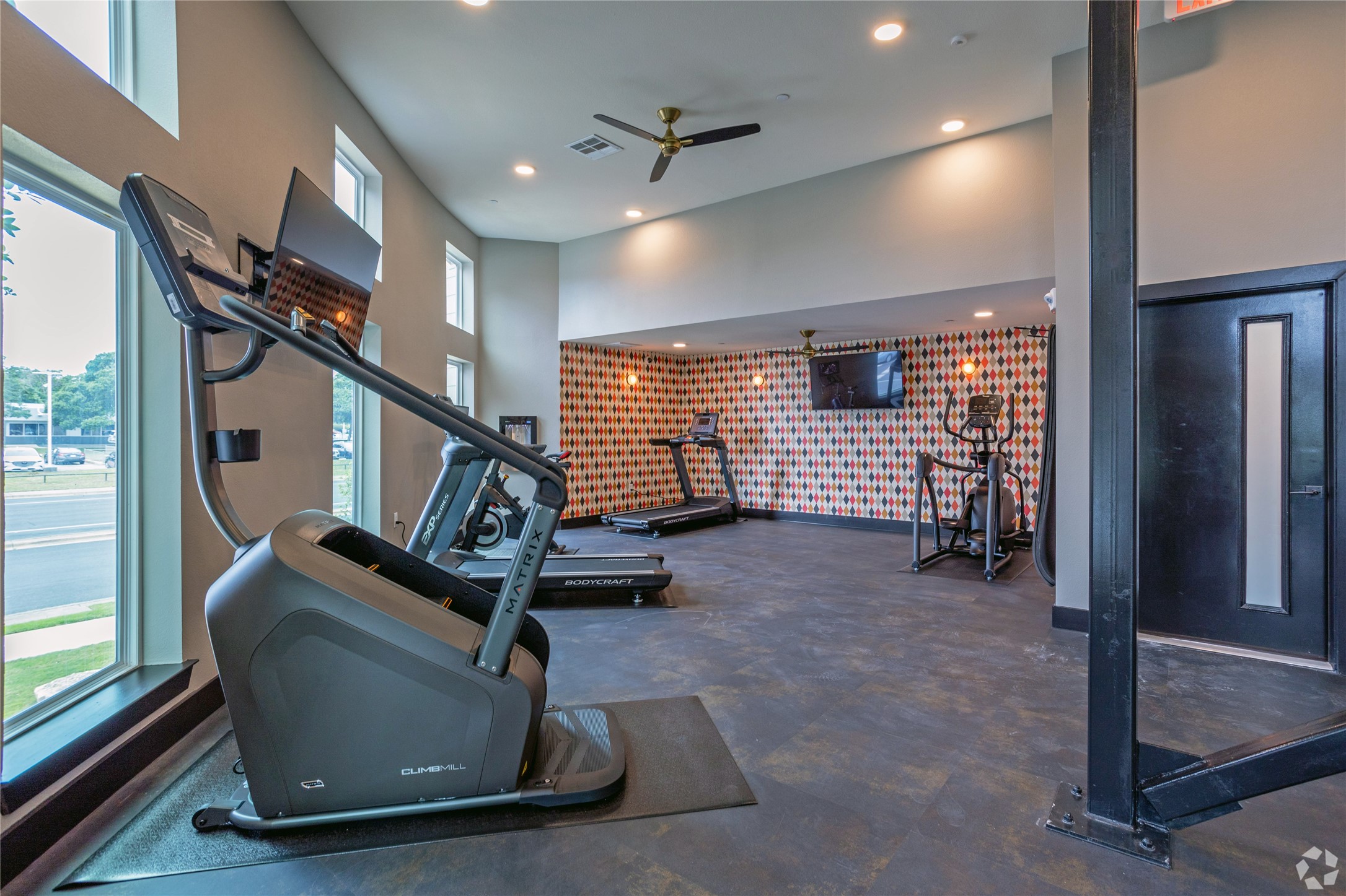 10010 North Capital Of Texas Highway, Unit 116 Austin, TX 78759 - Photo 7 of 20 a room with gym equipment and windows