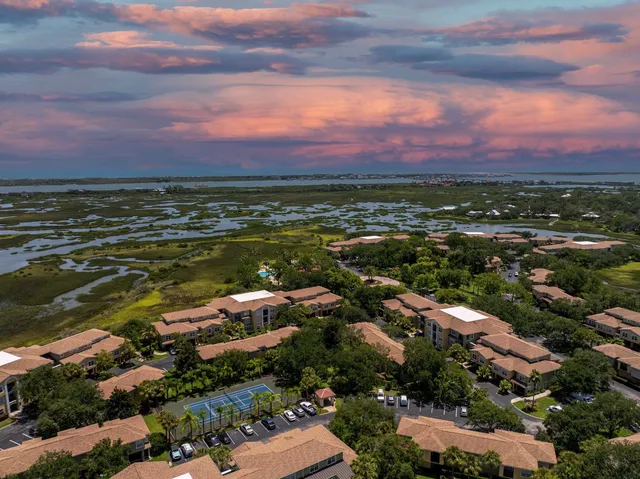 an aerial view of residential building and ocean