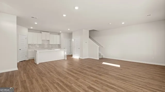 a bathroom with a shower and a sink