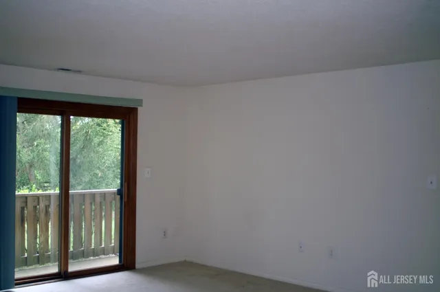 a view of a room that has a large window