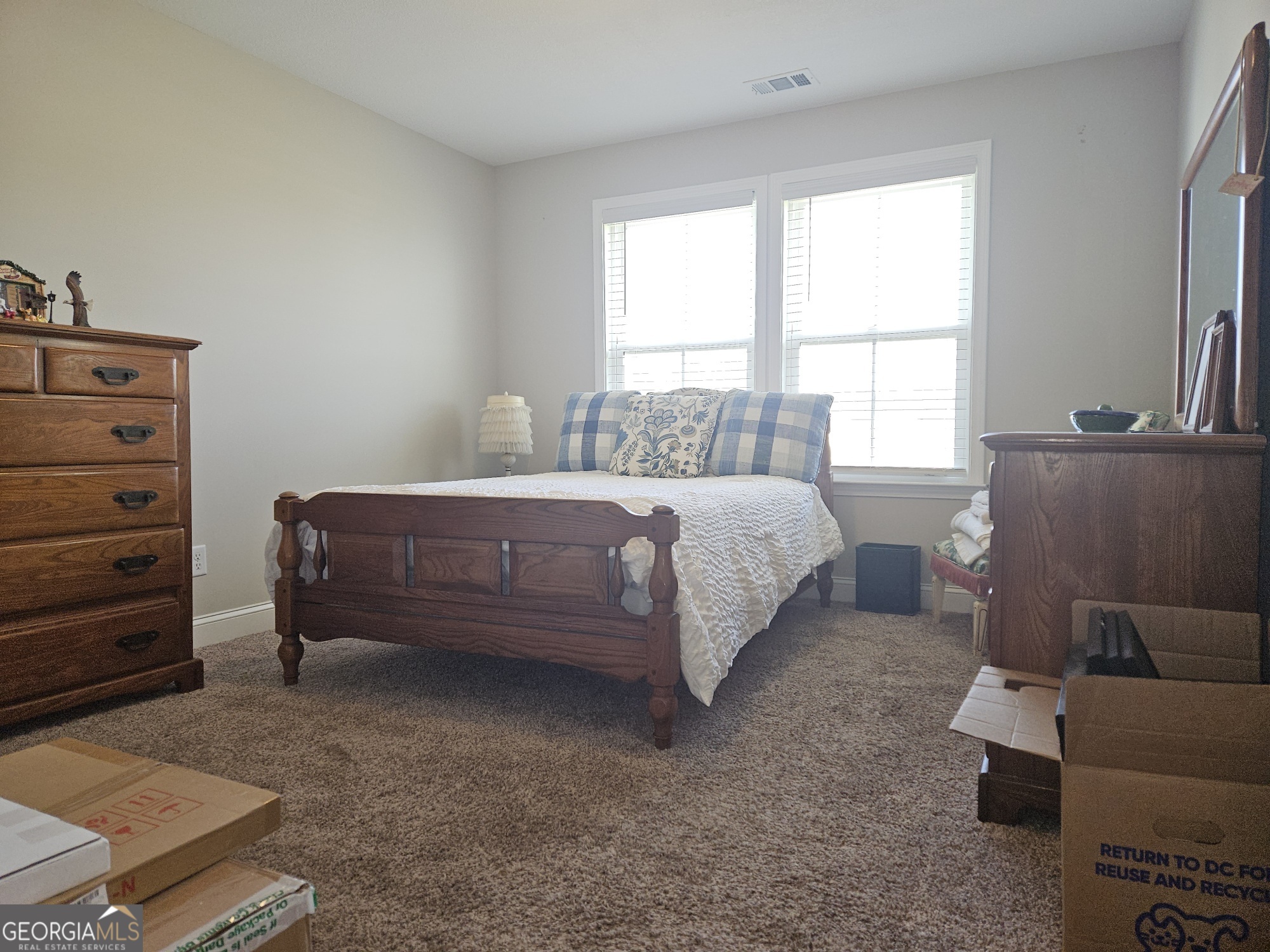 101 Old Barn Road Statesboro, GA 30458 - Photo 11 of 16 a bedroom with a bed and a window