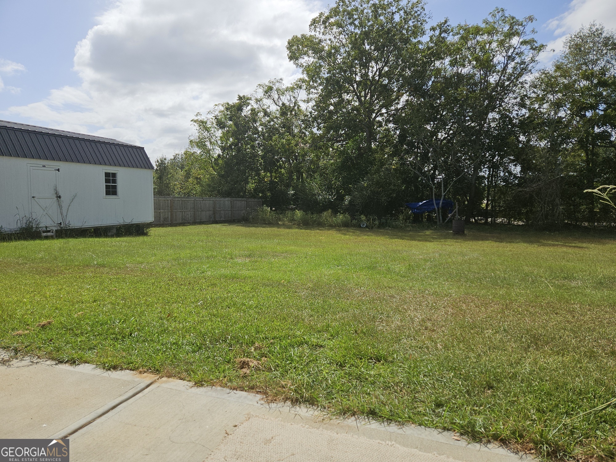 101 Old Barn Road Statesboro, GA 30458 - Photo 2 of 16 a view of a large yard with a large trees