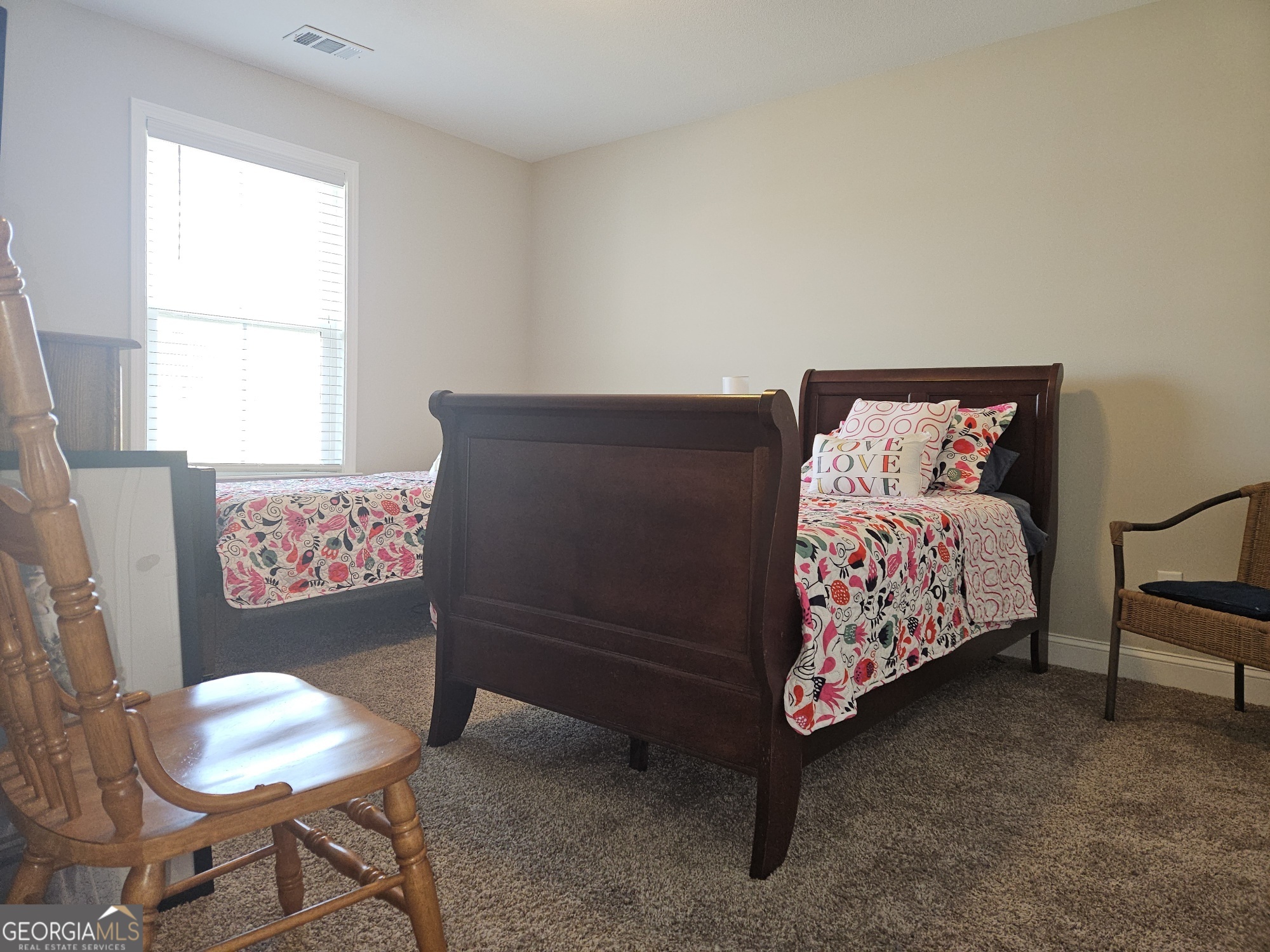 101 Old Barn Road Statesboro, GA 30458 - Photo 10 of 16 a bed sitting in a bedroom next to a window