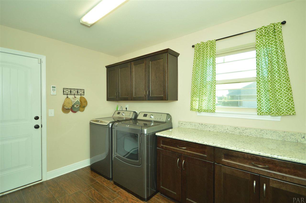 2621 Tulip Hill Road Pace, FL 32571 - Photo 35 of 48 with cabinetry and countertop