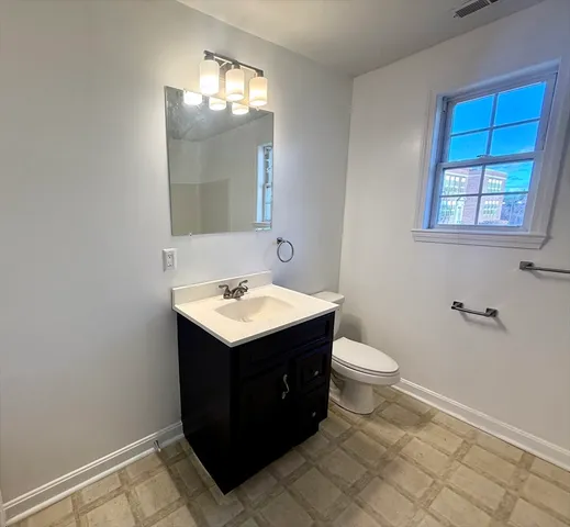 a view of bathroom with a sink and a toilet
