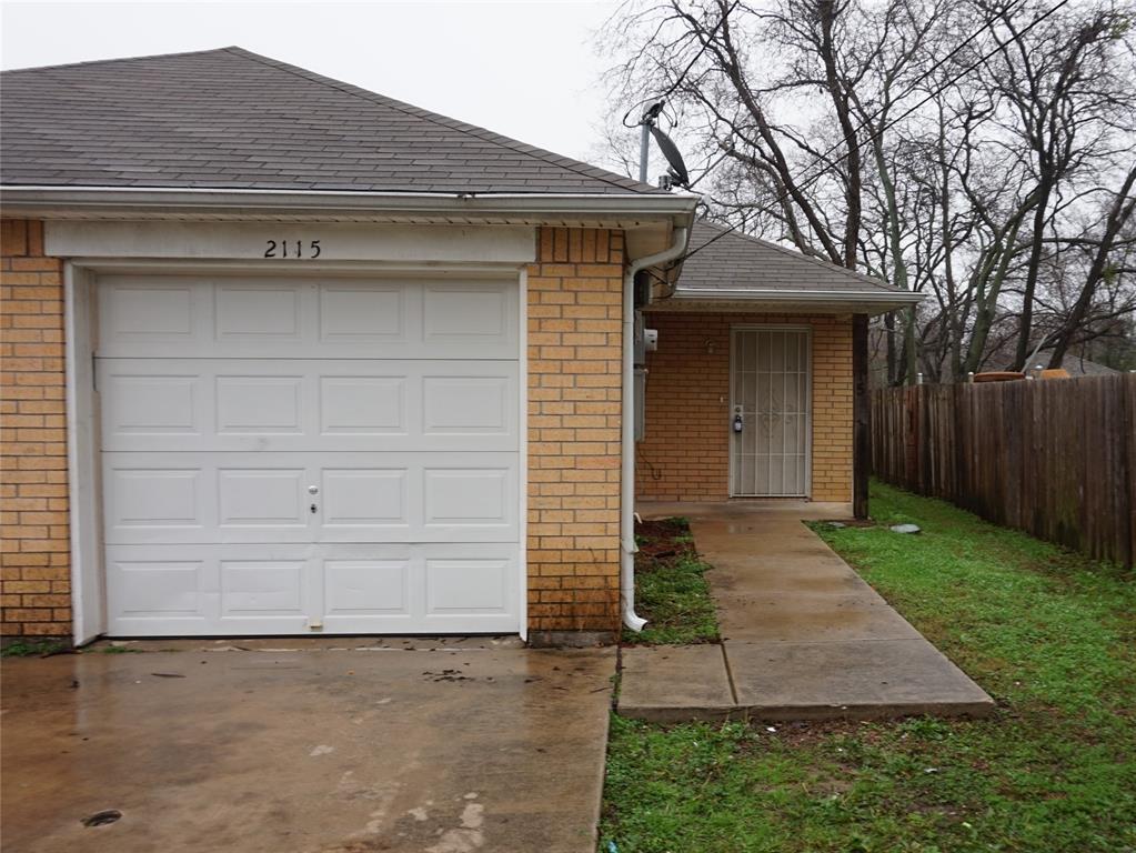 2113 R W Bivens Street, Unit 2115 Fort Worth, TX 76105 - Photo 1 of 1 a front view of a house with a yard and garage