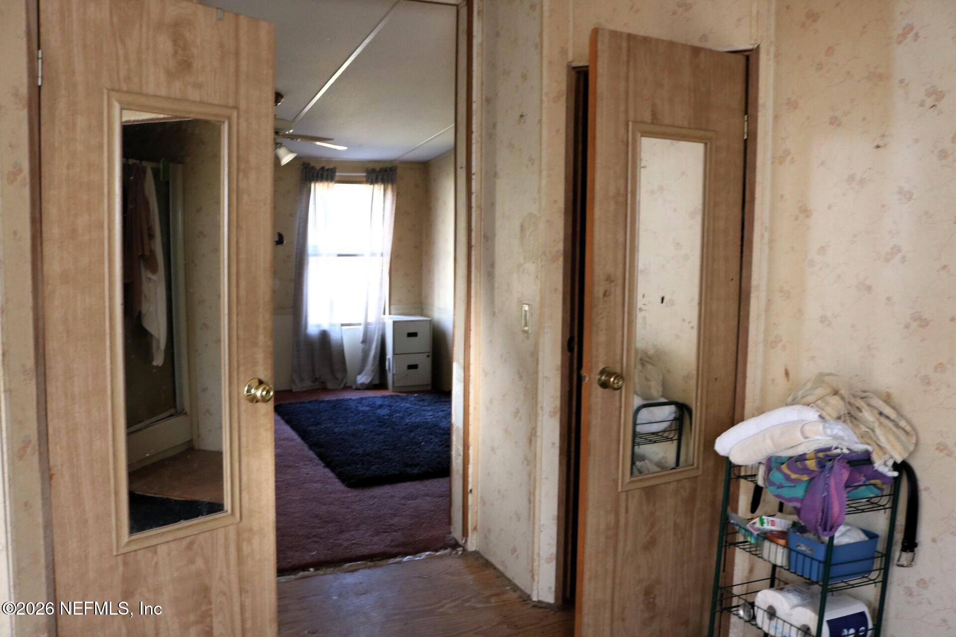 54089 Huckleberry Lane Callahan, FL 32011 - Photo 12 of 18 a view of hallway with furniture and a livingroom