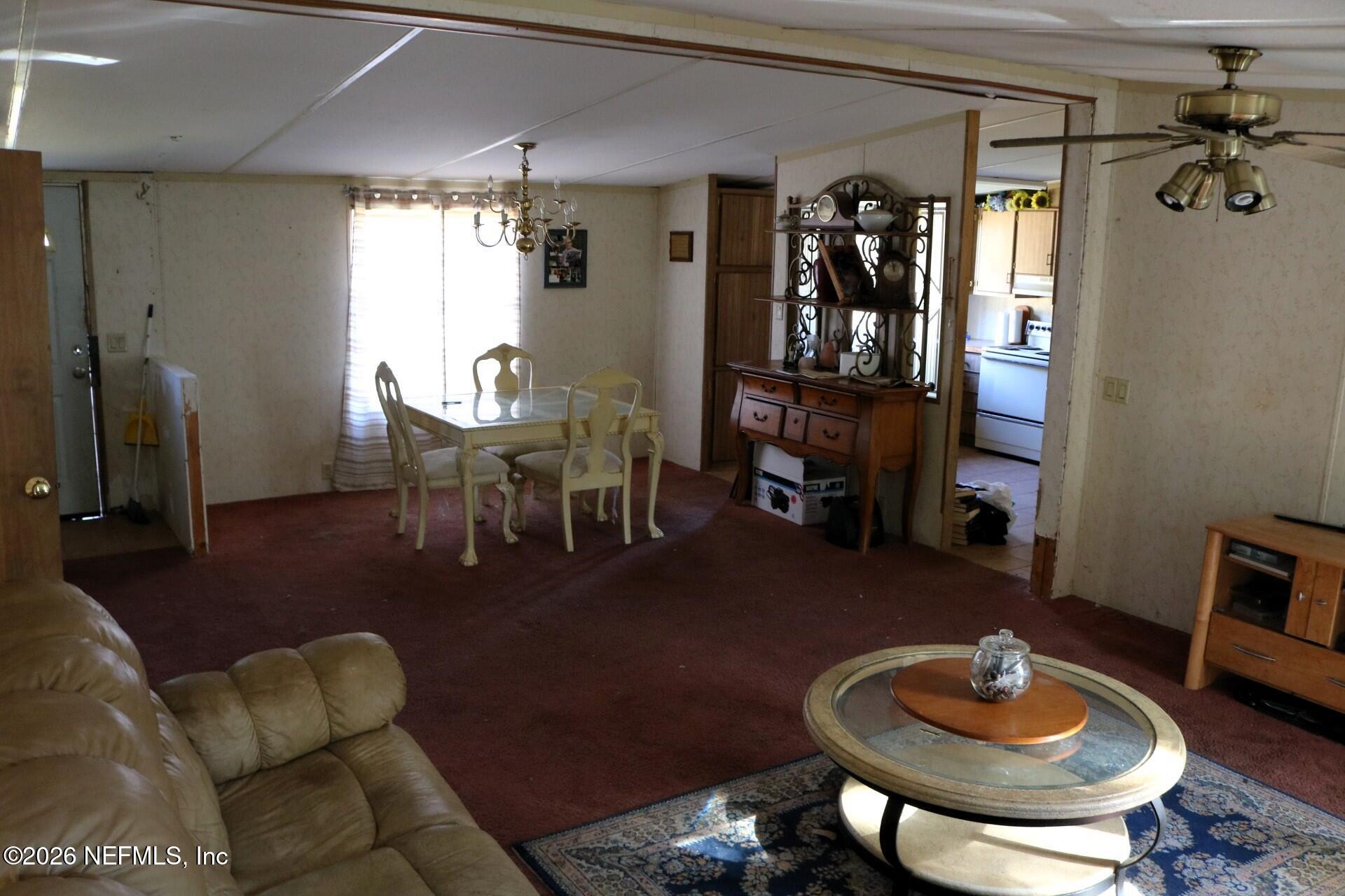 54089 Huckleberry Lane Callahan, FL 32011 - Photo 15 of 18 a living room with furniture and a wooden floor