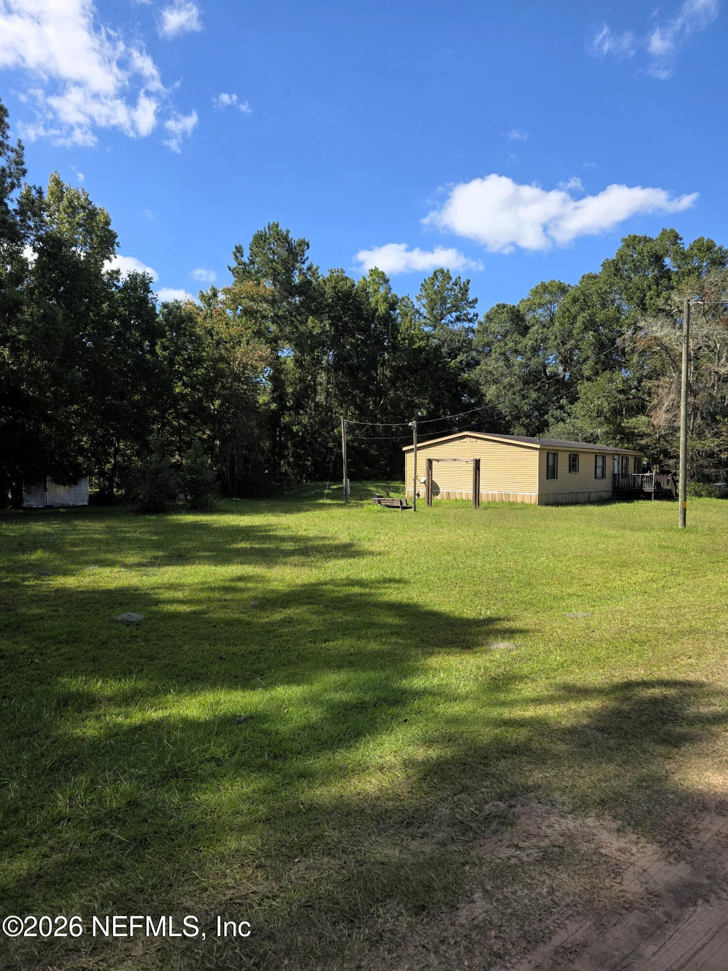 54089 Huckleberry Lane Callahan, FL 32011 - Photo 5 of 18 a view of a golf course with a lake