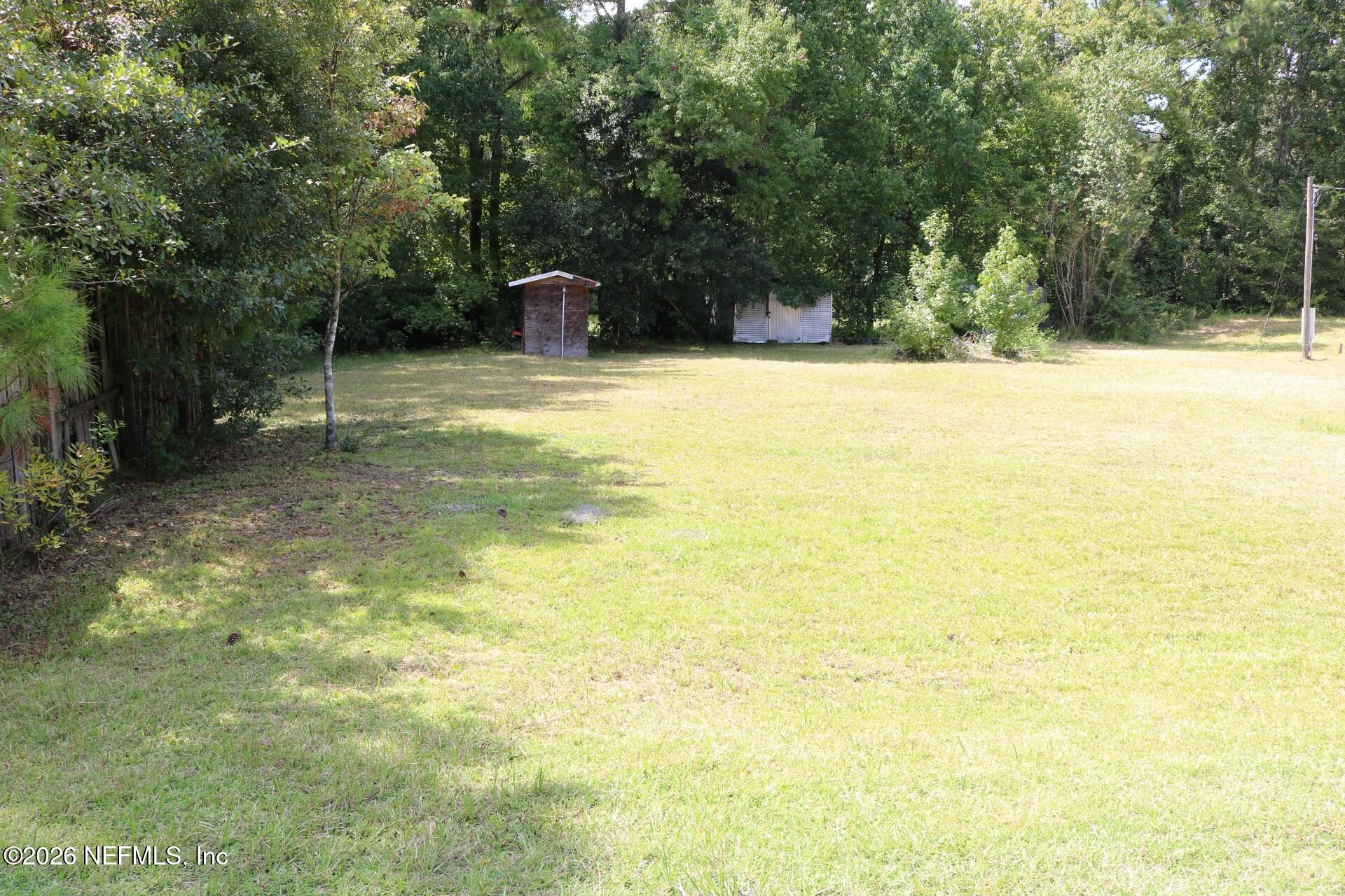 54089 Huckleberry Lane Callahan, FL 32011 - Photo 7 of 18 a swimming pool with an outdoor space and seating area