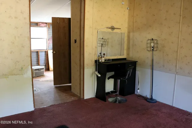 a kitchen with a refrigerator and a window