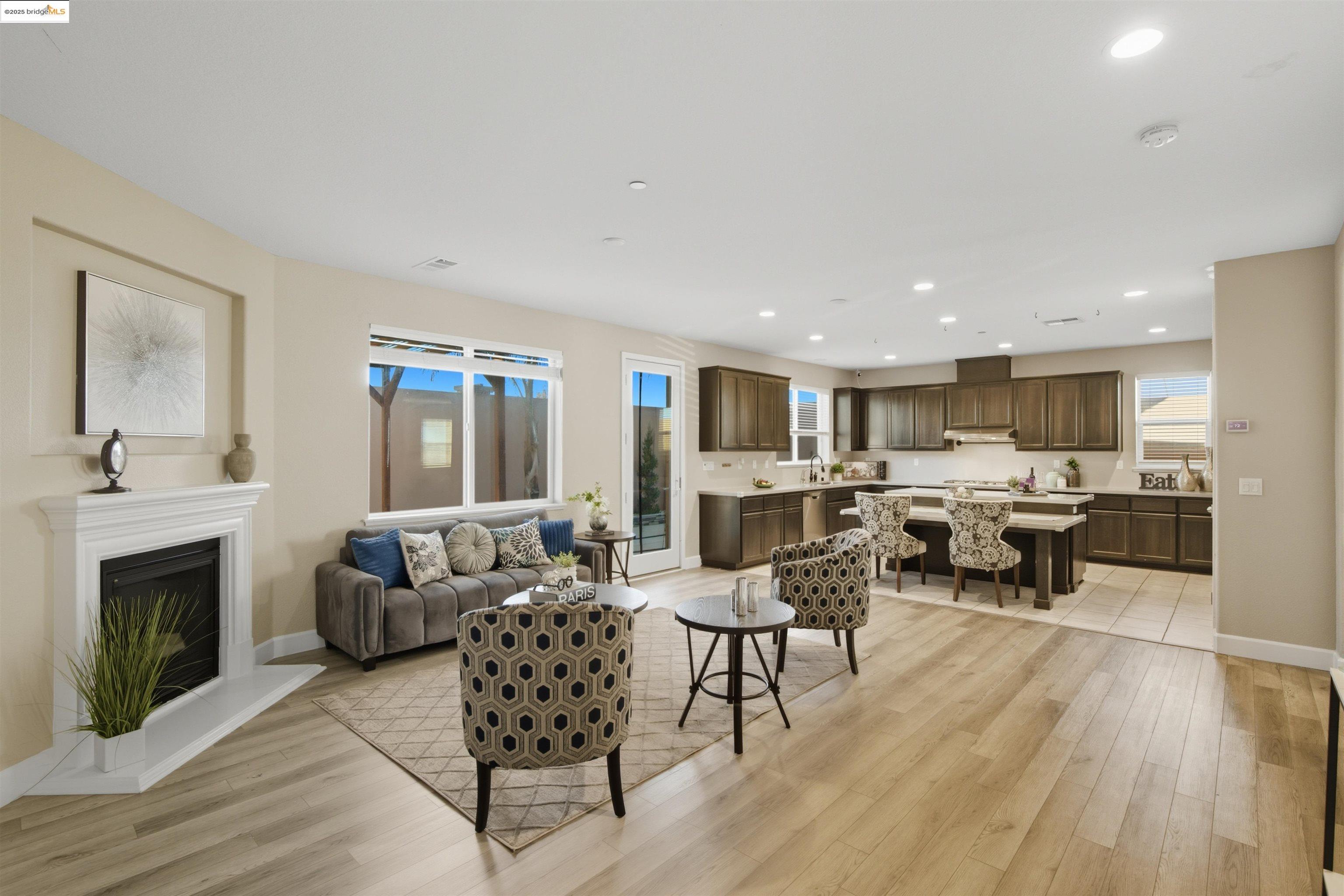 536 Aster Street Vacaville, CA 95688 - Photo 17 of 53 Living area featuring recessed lighting, light wood-style flooring, plenty of natural light, and a fireplace with raised hearth