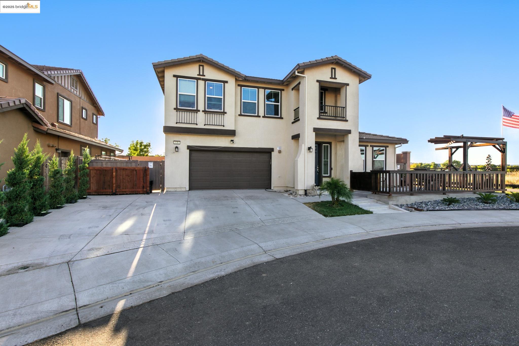 536 Aster Street Vacaville, CA 95688 - Photo 2 of 53 View of front facade with an attached garage, driveway, a balcony, stucco siding, and a tile roof