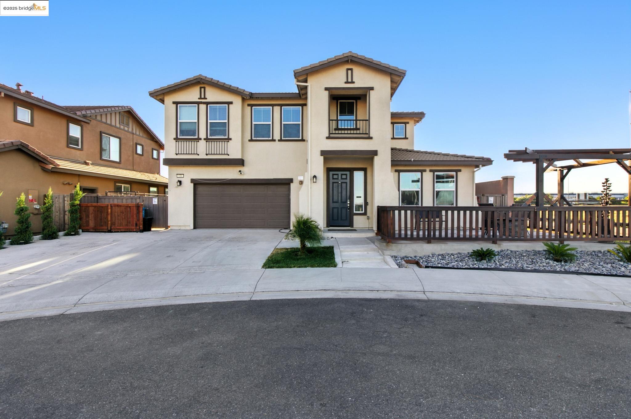 536 Aster Street Vacaville, CA 95688 - Photo 3 of 53 View of front of house with a garage, concrete driveway, stucco siding, a balcony, and a tile roof