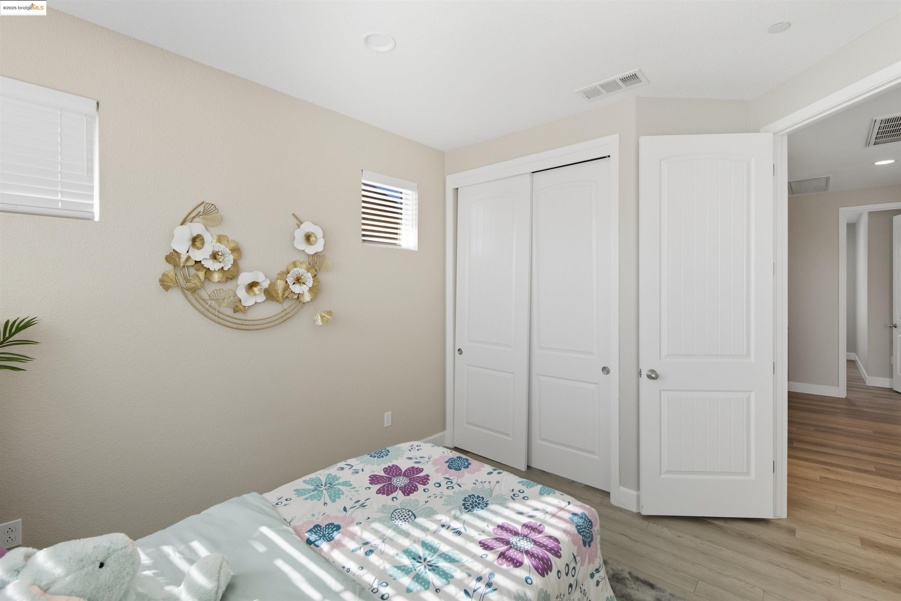 536 Aster Street Vacaville, CA 95688 - Photo 35 of 53 Bedroom featuring light wood finished floors, a closet, and recessed lighting