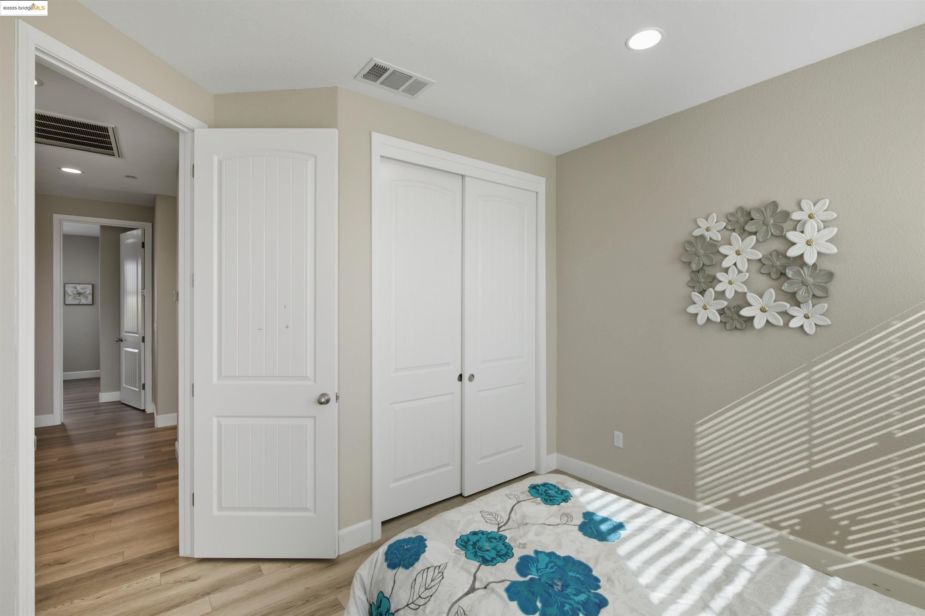 536 Aster Street Vacaville, CA 95688 - Photo 37 of 53 Unfurnished bedroom featuring recessed lighting, a closet, and wood finished floors