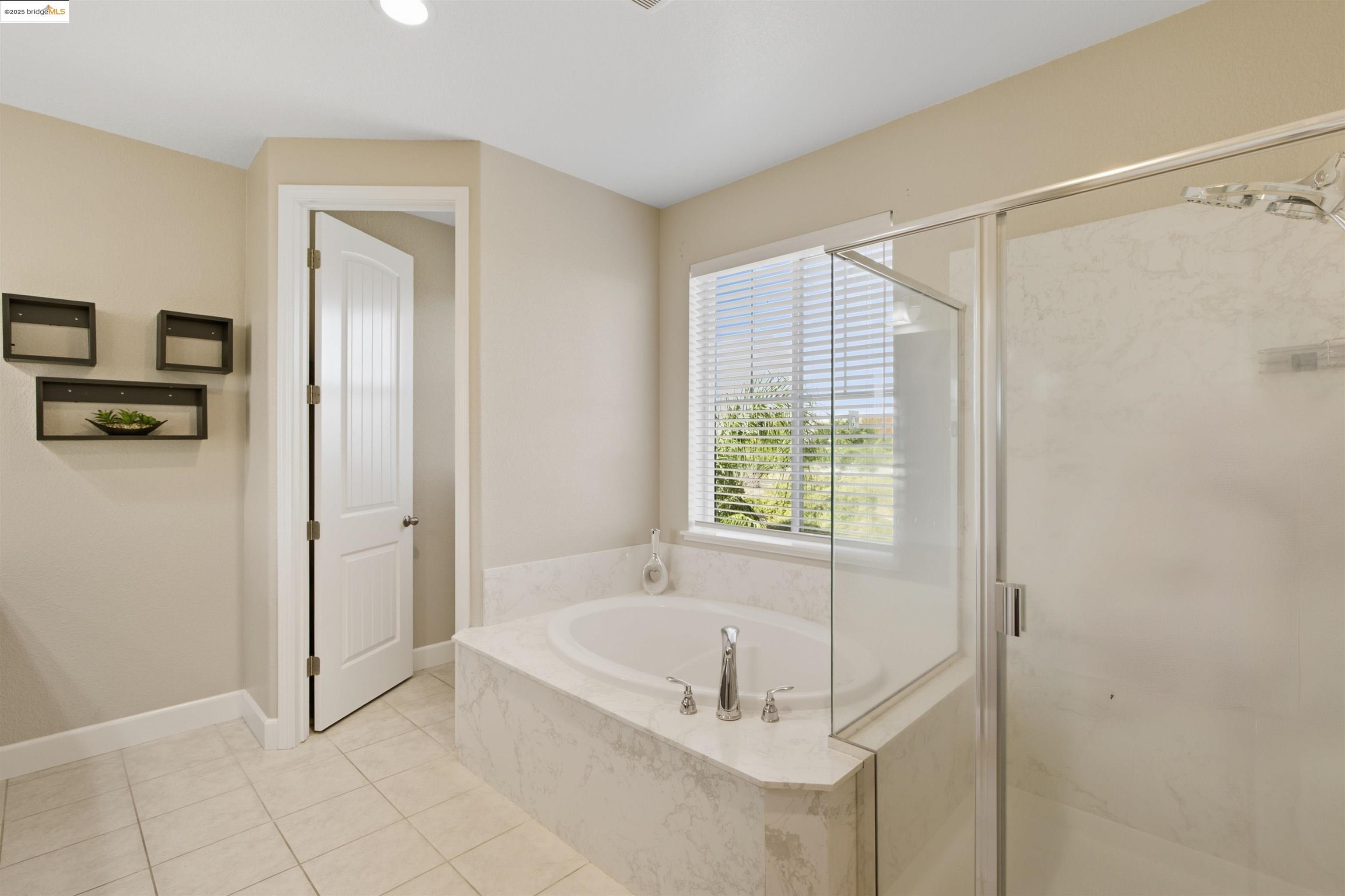 536 Aster Street Vacaville, CA 95688 - Photo 41 of 53 Bathroom with a marble finish shower, a garden tub, light tile patterned floors, and recessed lighting