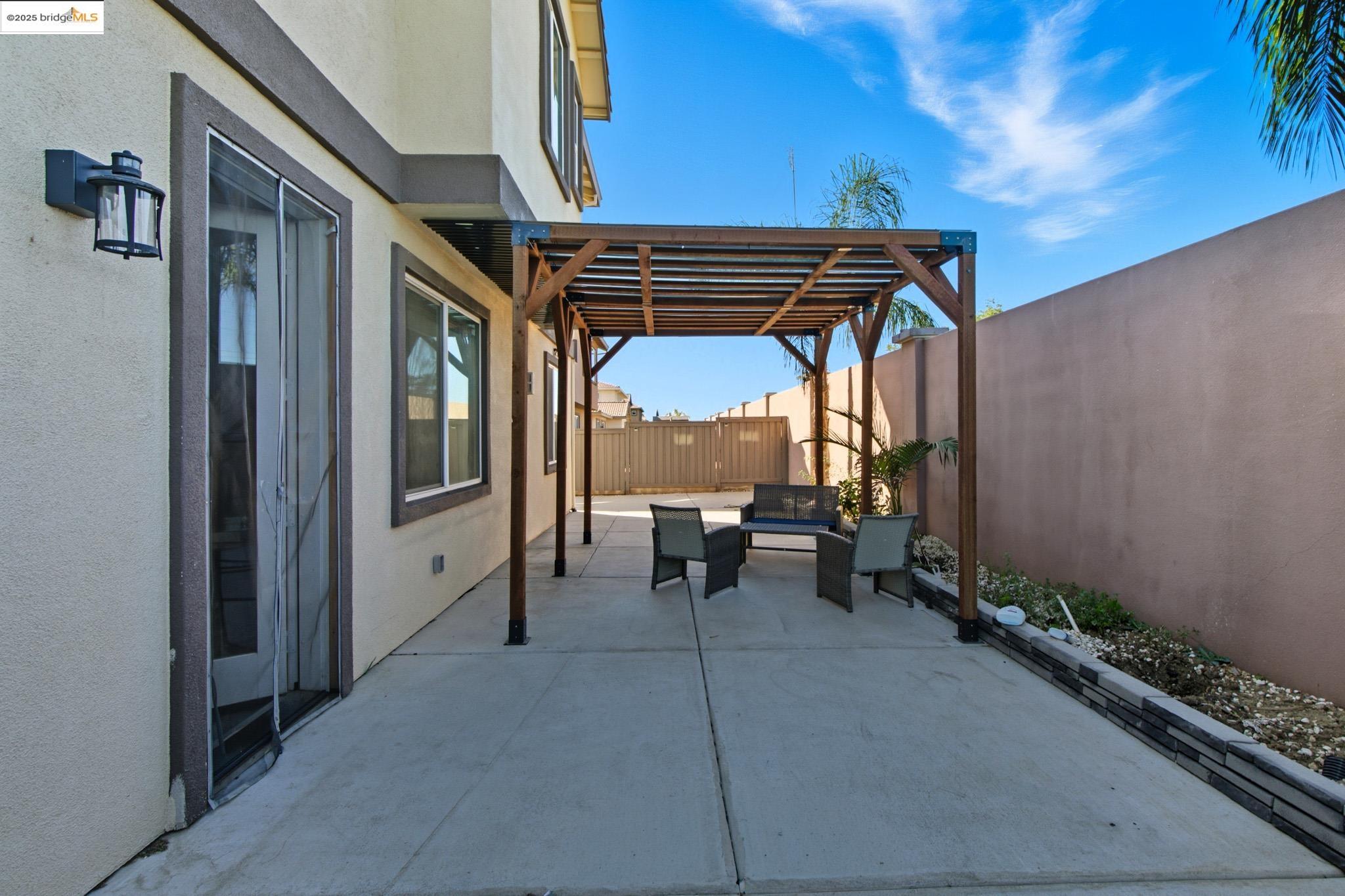 536 Aster Street Vacaville, CA 95688 - Photo 43 of 53 Fenced backyard with a patio, a pergola, and an outdoor living space