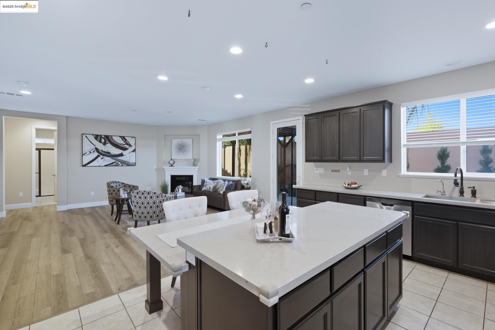536 Aster Street Vacaville, CA 95688 - Photo 53 of 53 Kitchen with a fireplace, recessed lighting, open floor plan, a kitchen island, and dishwasher