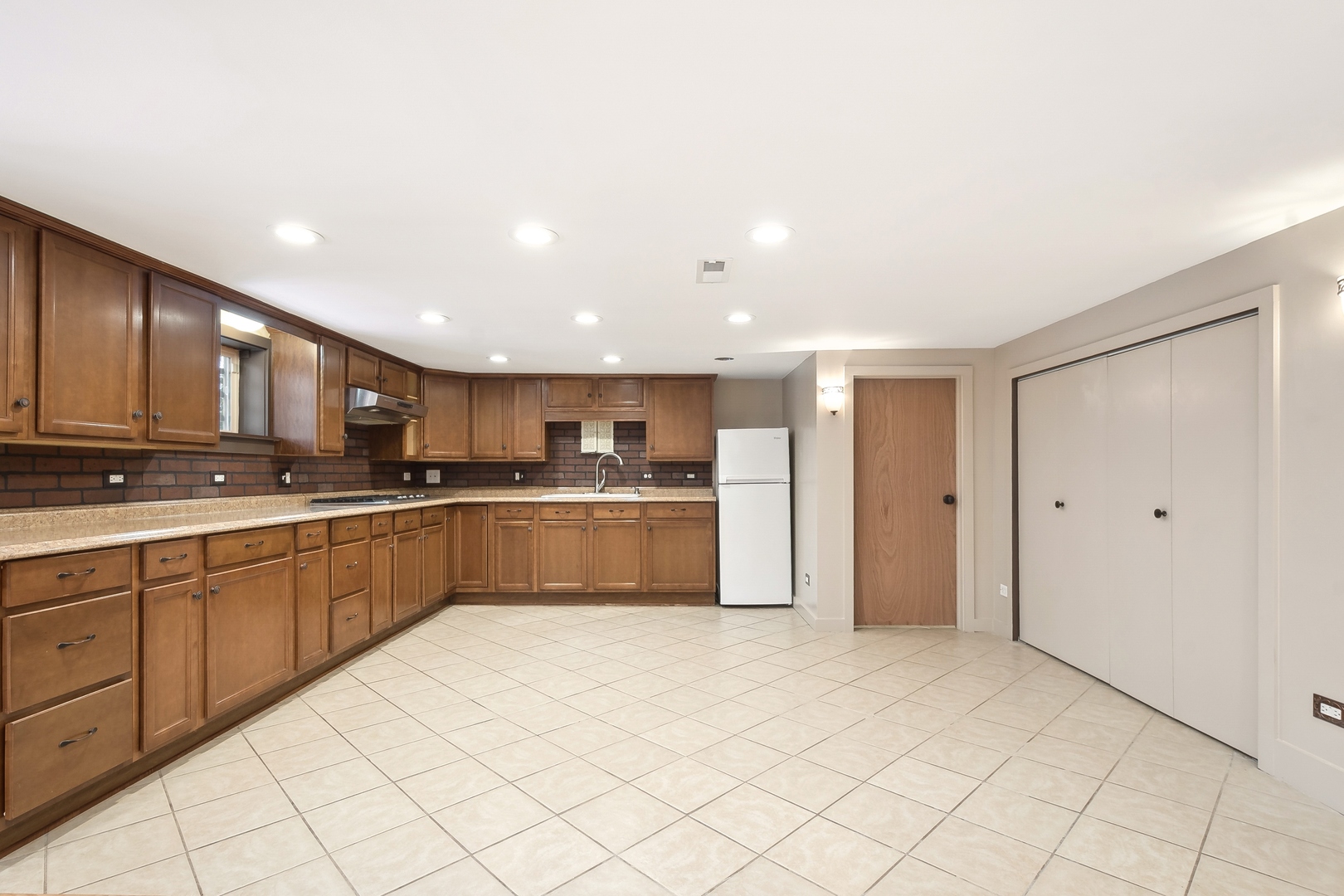 207 North Happ Road Northfield, IL 60093 - Photo 20 of 28 a large kitchen with stainless steel appliances granite countertop a refrigerator and a sink