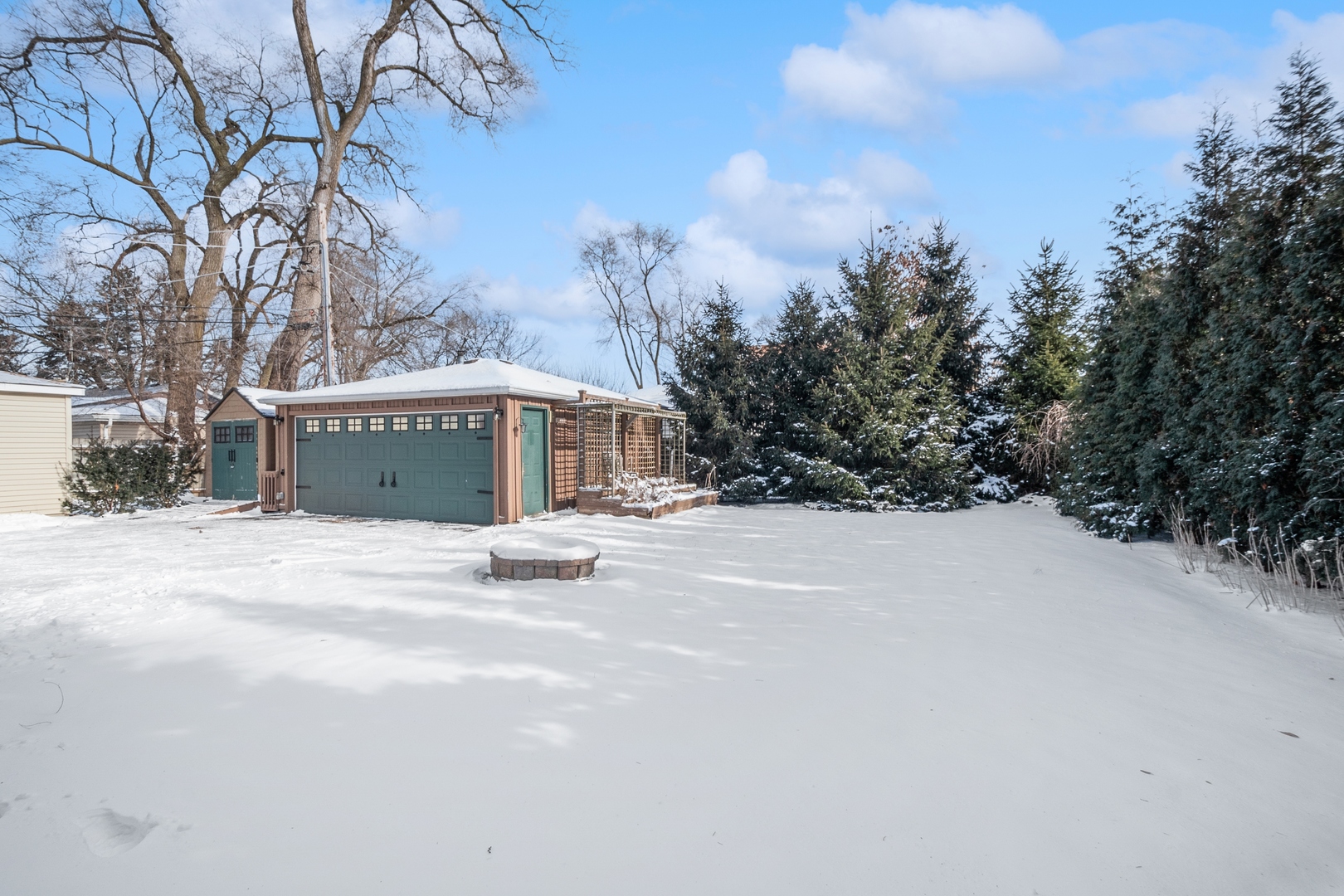207 North Happ Road Northfield, IL 60093 - Photo 25 of 28 a view of a house with snow on the road