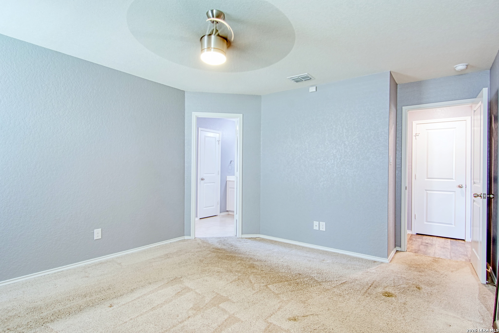 29516 Winter Copper Bulverde, TX 78163 - Photo 20 of 42 a view of an empty room and a chandelier fan