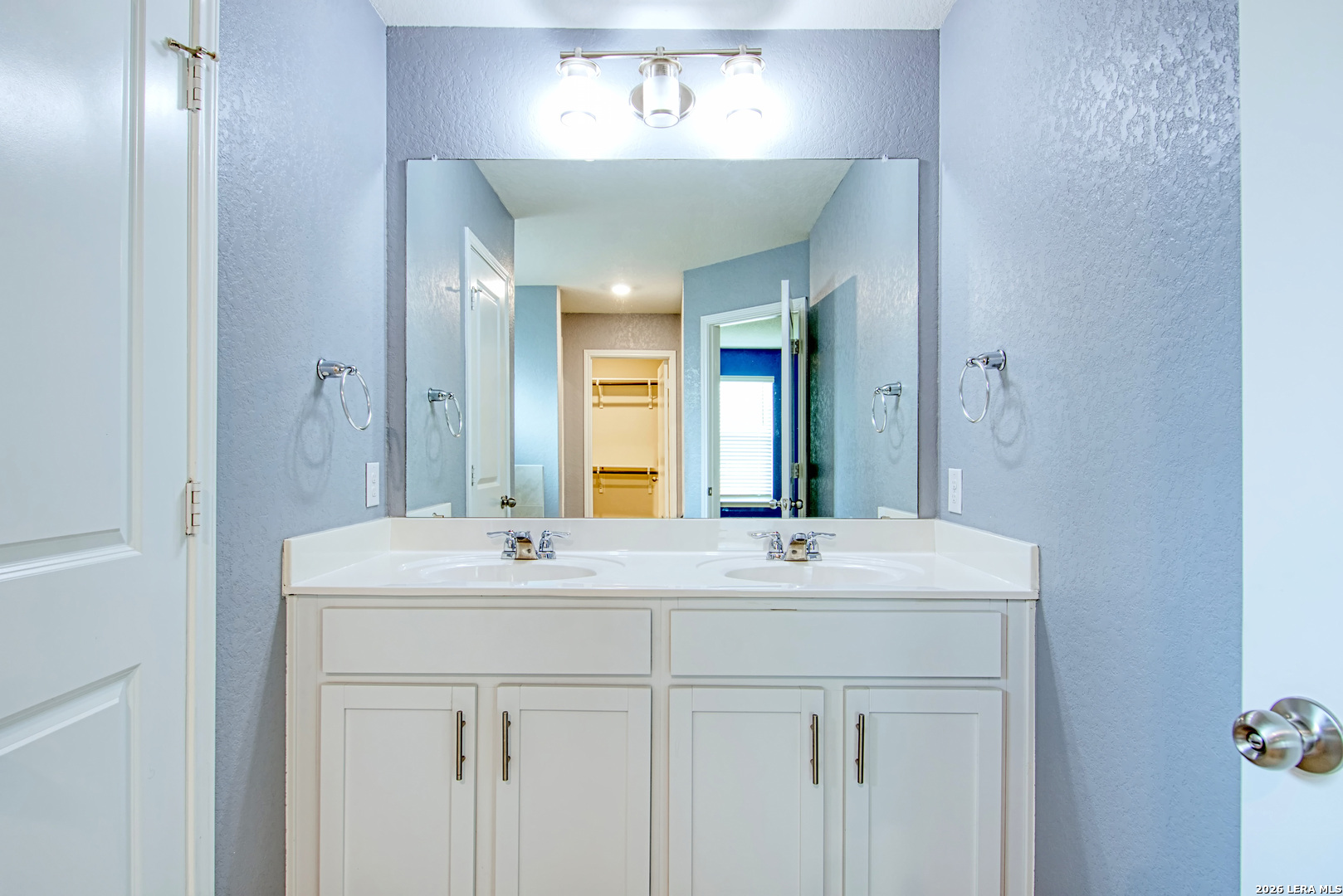 29516 Winter Copper Bulverde, TX 78163 - Photo 21 of 42 a bathroom with a sink and a mirror