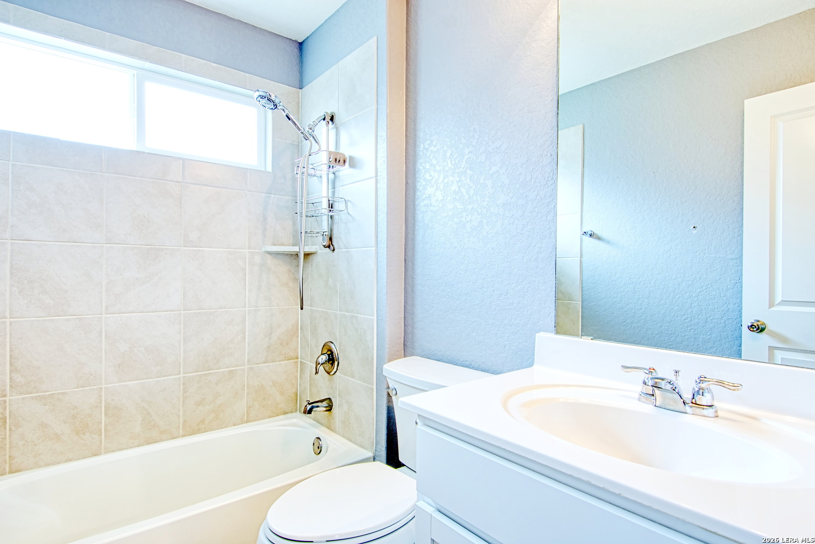 29516 Winter Copper Bulverde, TX 78163 - Photo 27 of 42 a bathroom with a granite countertop bathtub shower sink vanity mirror and toilet