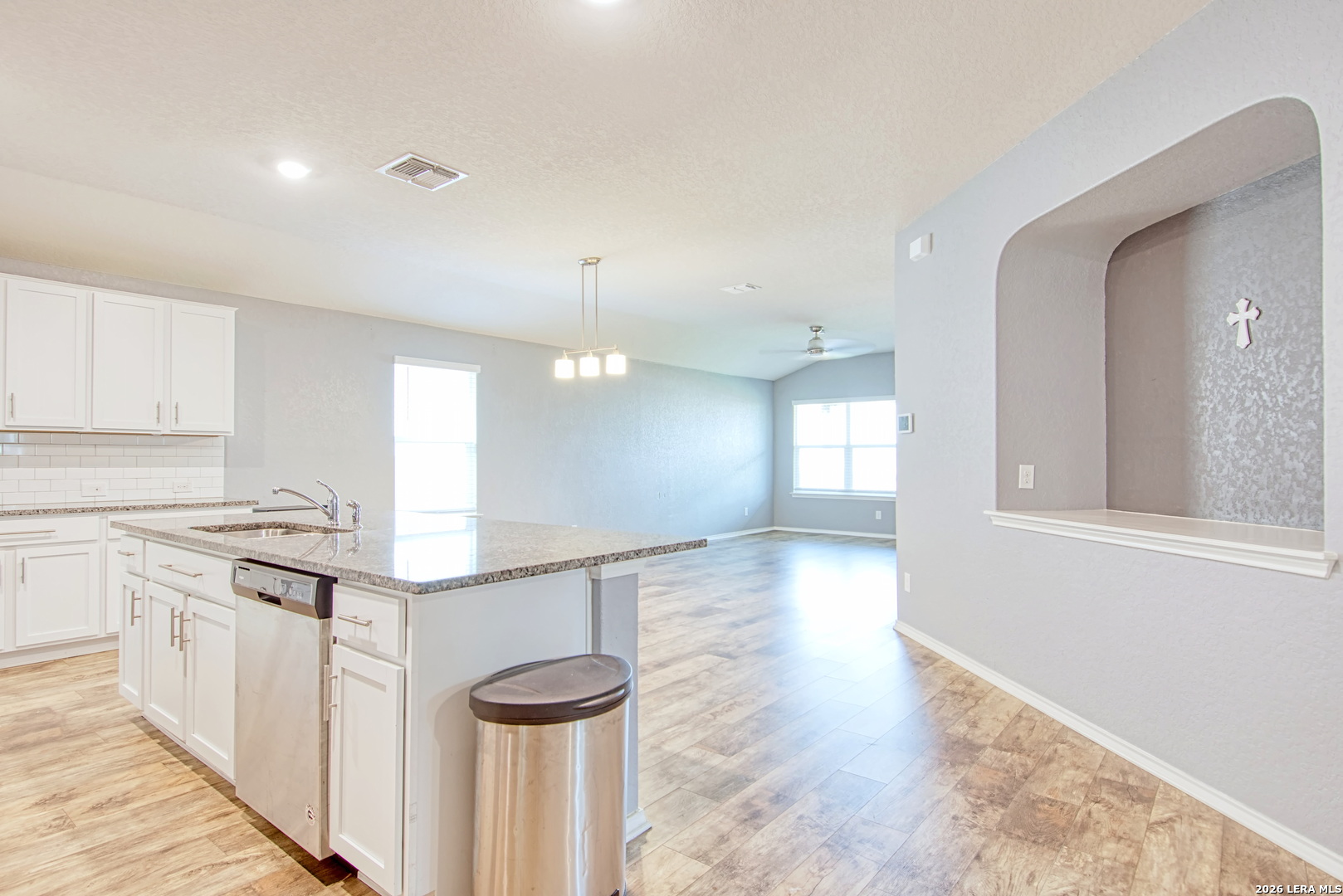 29516 Winter Copper Bulverde, TX 78163 - Photo 8 of 42 a kitchen with stainless steel appliances granite countertop a stove a sink and a refrigerator