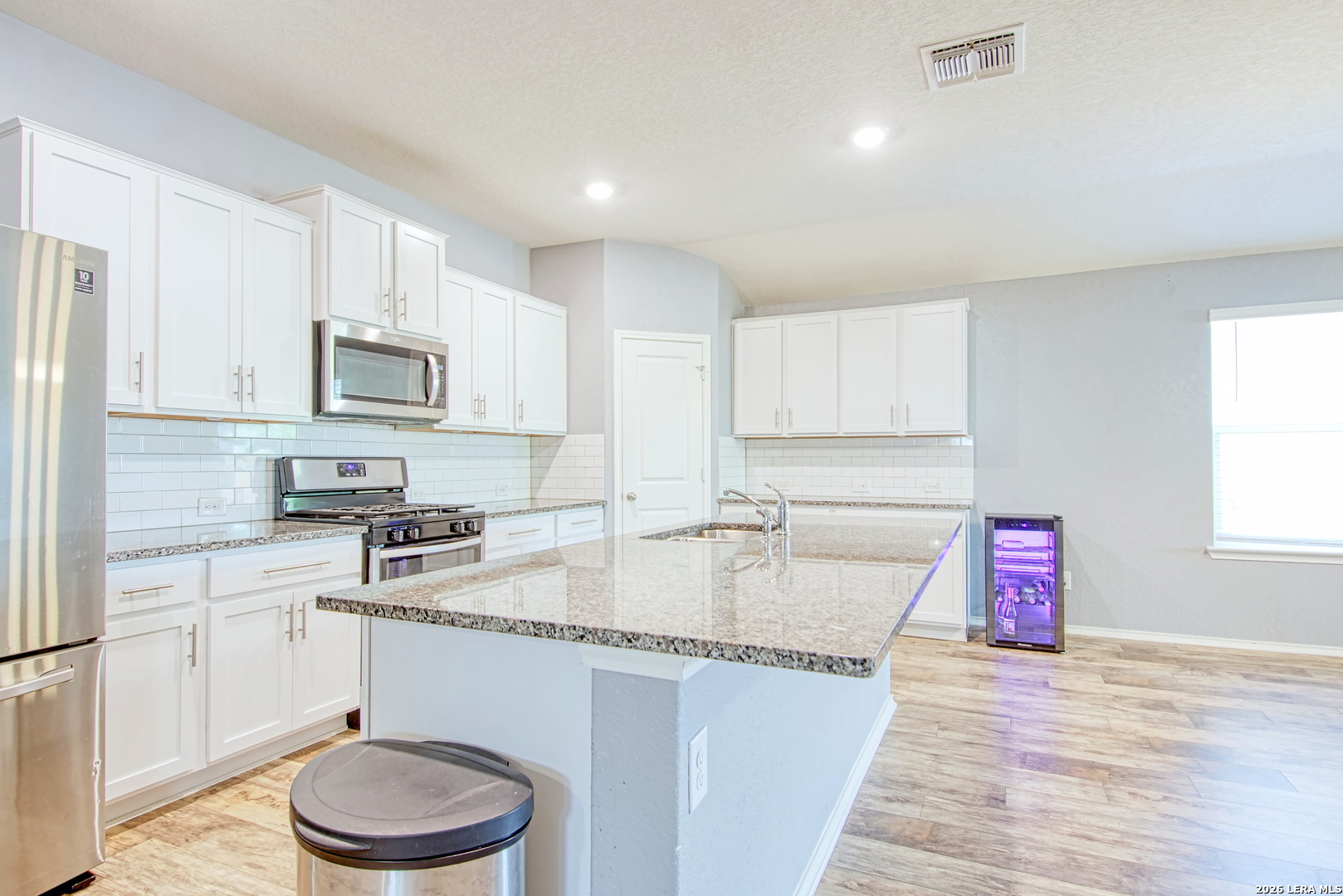 29516 Winter Copper Bulverde, TX 78163 - Photo 9 of 42 a kitchen with stainless steel appliances granite countertop a sink stove and cabinets