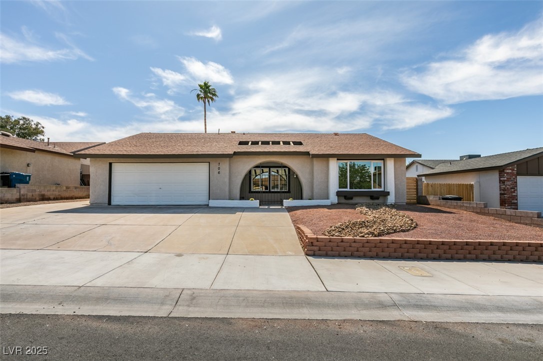 706 Greenway Road Henderson, NV 89002 - Photo 1 of 1 Ranch-style house featuring stucco siding, an attached garage, and driveway