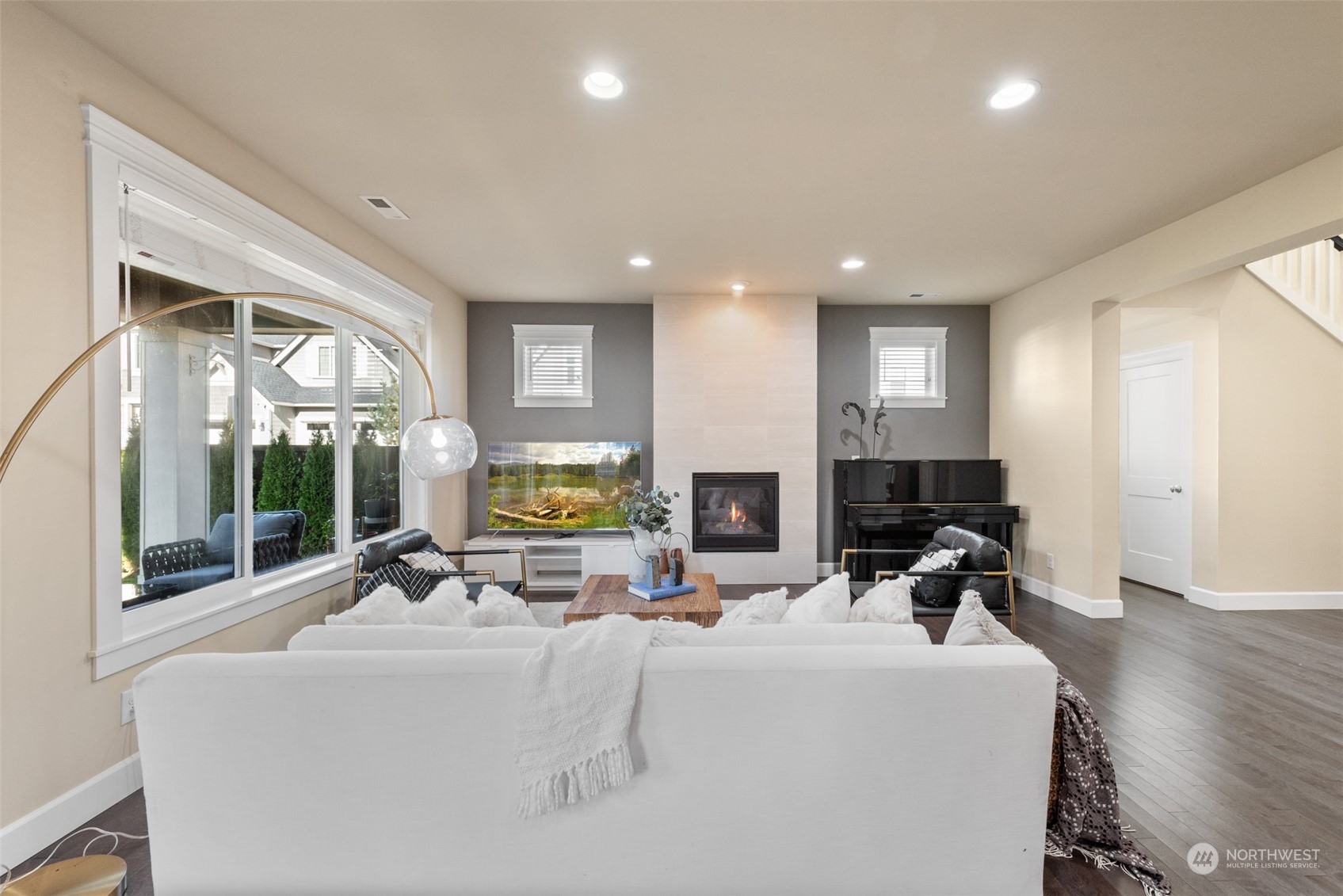 23112 8th Avenue Southeast Bothell, WA 98021 - Photo 6 of 37 a view of living room with furniture a fireplace and a floor to ceiling window