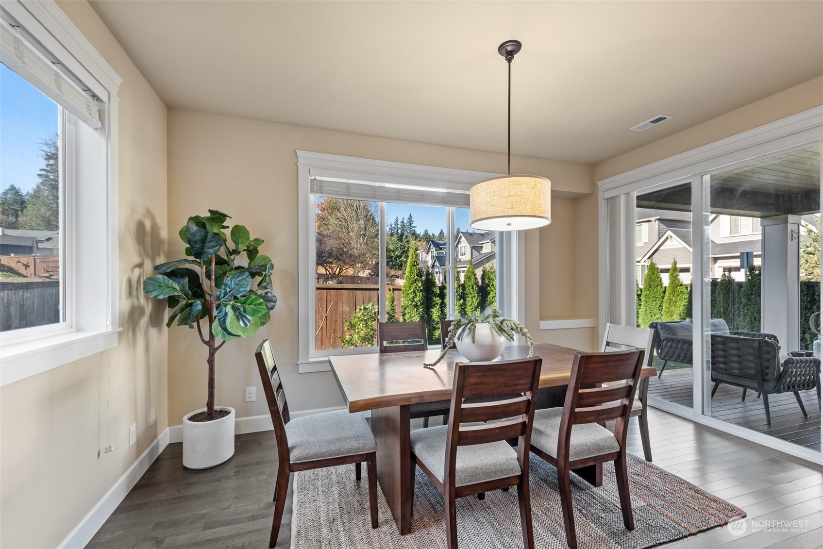 23112 8th Avenue Southeast Bothell, WA 98021 - Photo 8 of 37 a dining room with furniture potted plants and wooden floor