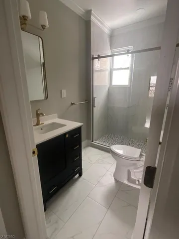 a spacious bathroom with a sink toilet and shower
