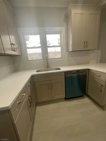 a kitchen with a sink and cabinets