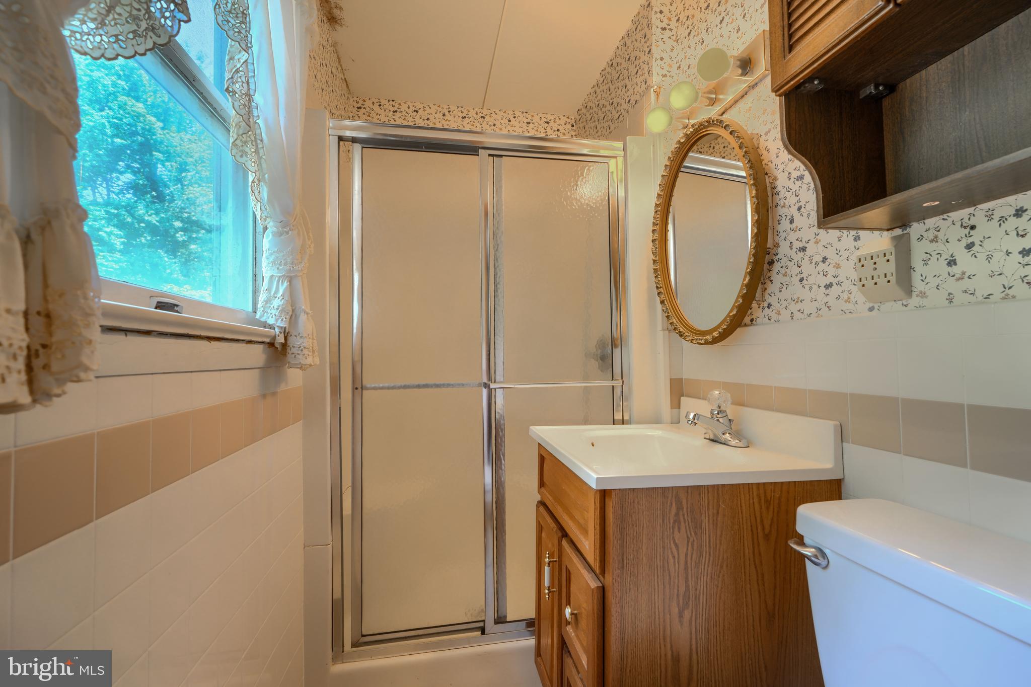 3743 Schroeder Avenue Perry Hall, MD 21128 - Photo 26 of 60 a bathroom with a sink and a mirror
