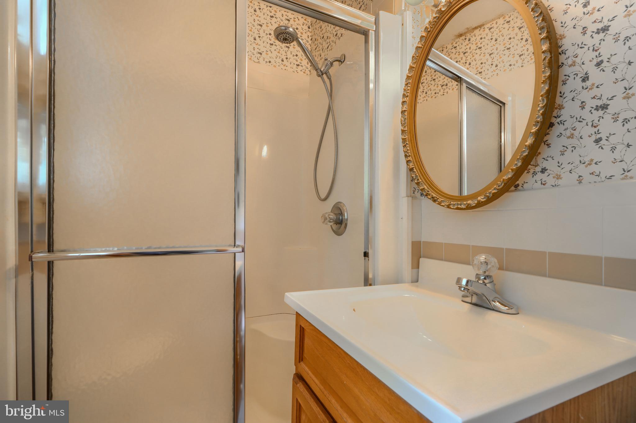 3743 Schroeder Avenue Perry Hall, MD 21128 - Photo 27 of 60 a bathroom with a sink vanity and a mirror
