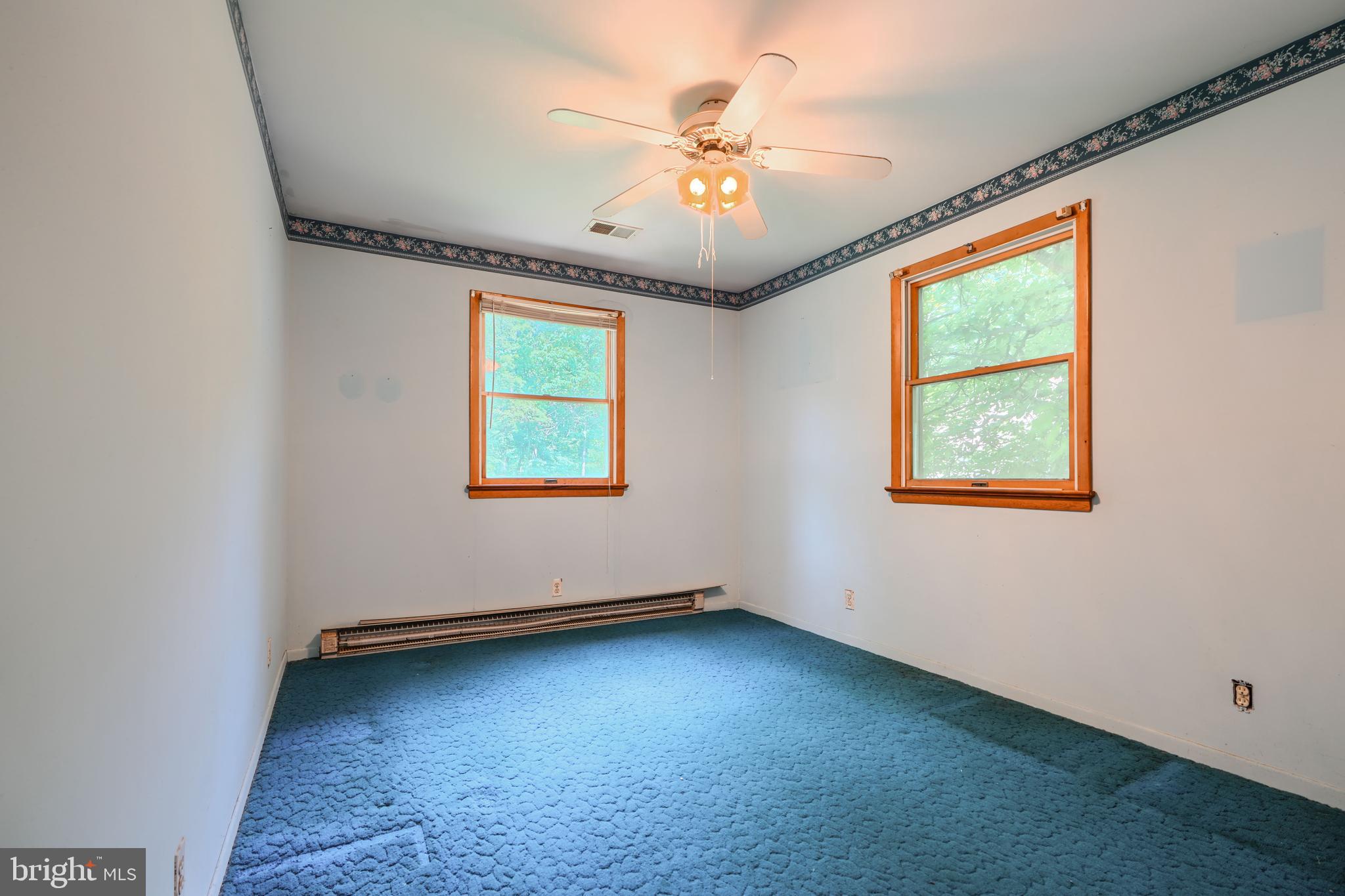 3743 Schroeder Avenue Perry Hall, MD 21128 - Photo 28 of 60 an empty room with windows and fan