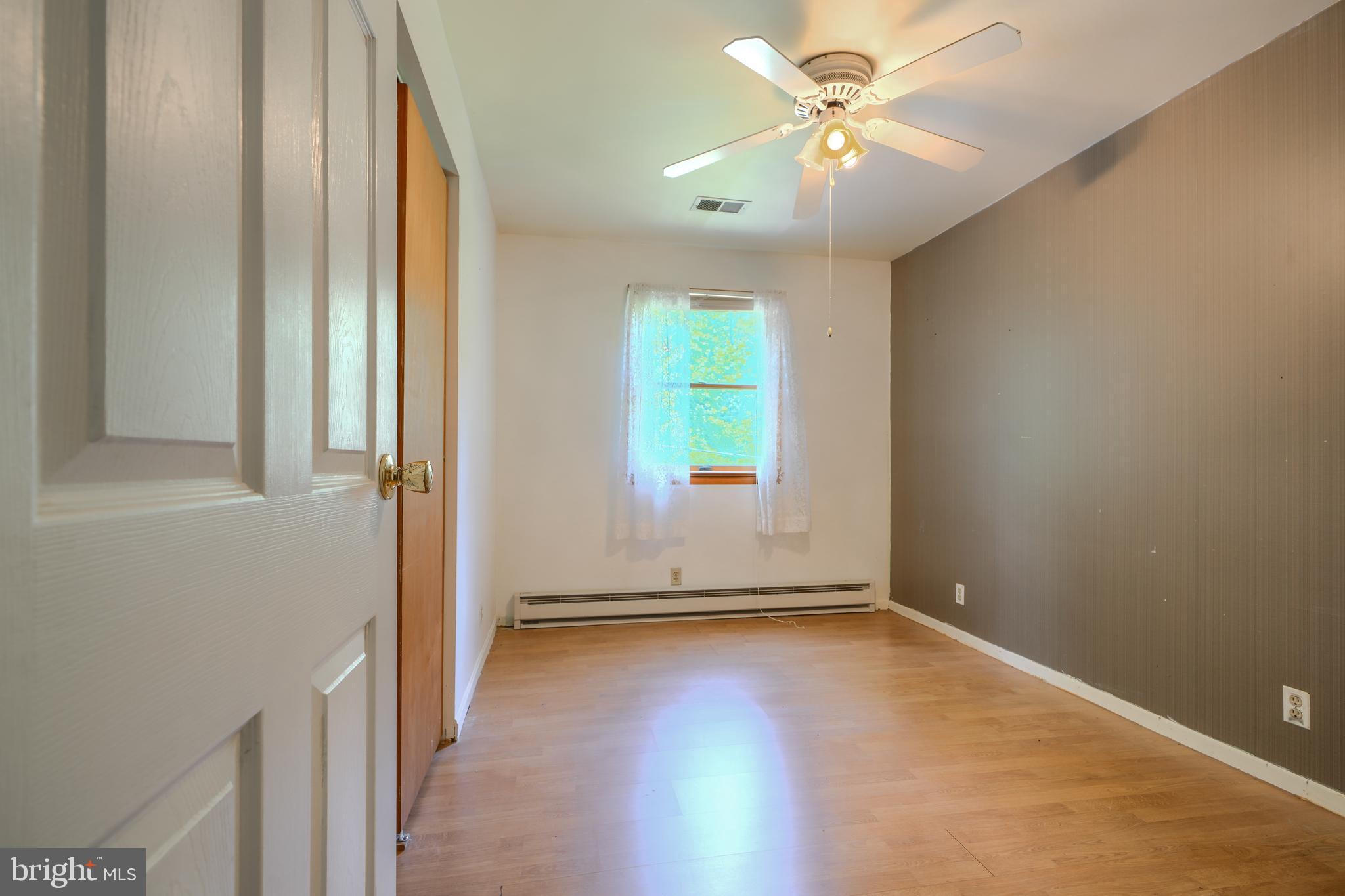 3743 Schroeder Avenue Perry Hall, MD 21128 - Photo 30 of 60 an empty room with windows and fan