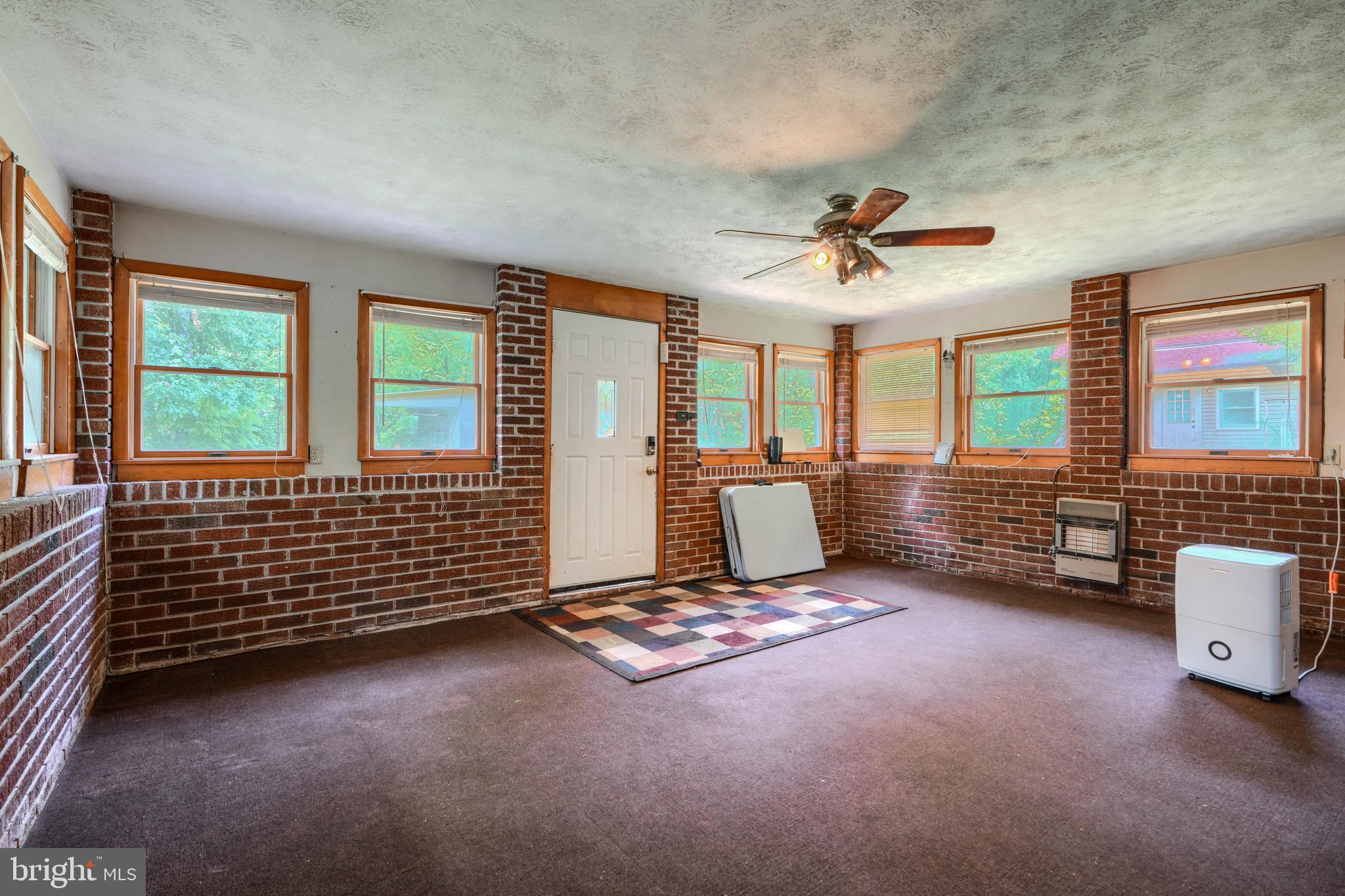 3743 Schroeder Avenue Perry Hall, MD 21128 - Photo 46 of 60 a living room with furniture lamp and large windows