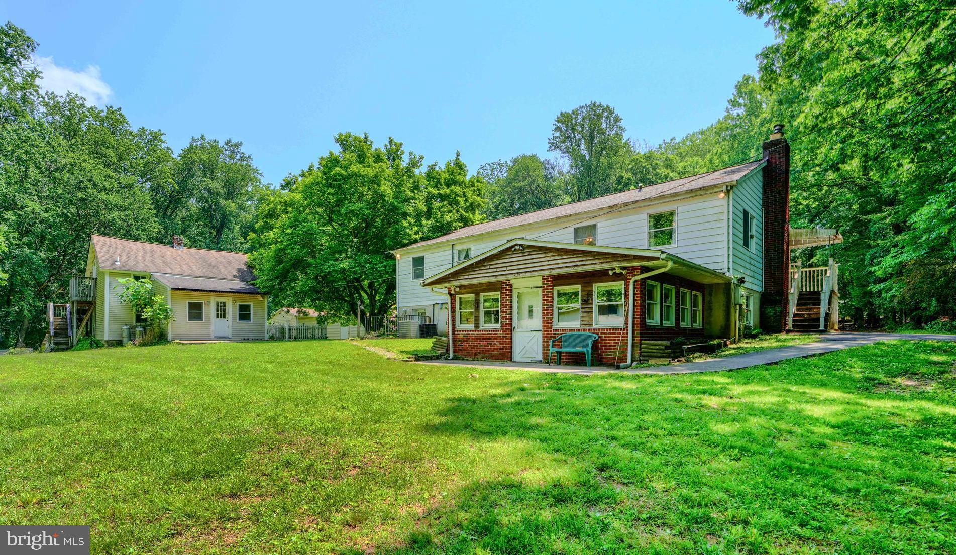 3743 Schroeder Avenue Perry Hall, MD 21128 - Photo 5 of 60 a view of a house with a big yard and large trees