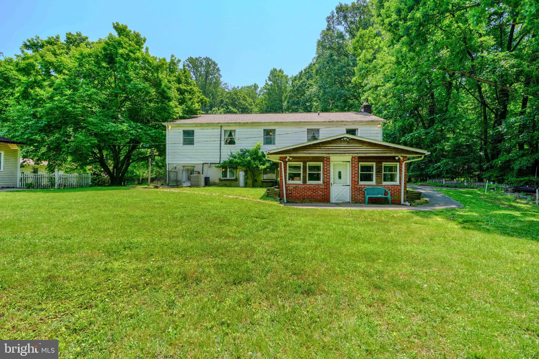 3743 Schroeder Avenue Perry Hall, MD 21128 - Photo 6 of 60 a view of a house with a big yard and large trees