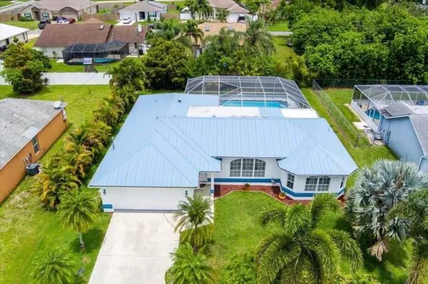 an aerial view of a house with a garden