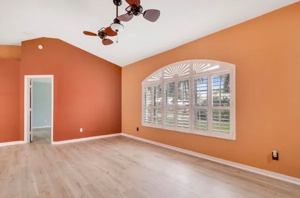 a view of an empty room with a window