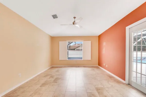 an empty room with windows and closet